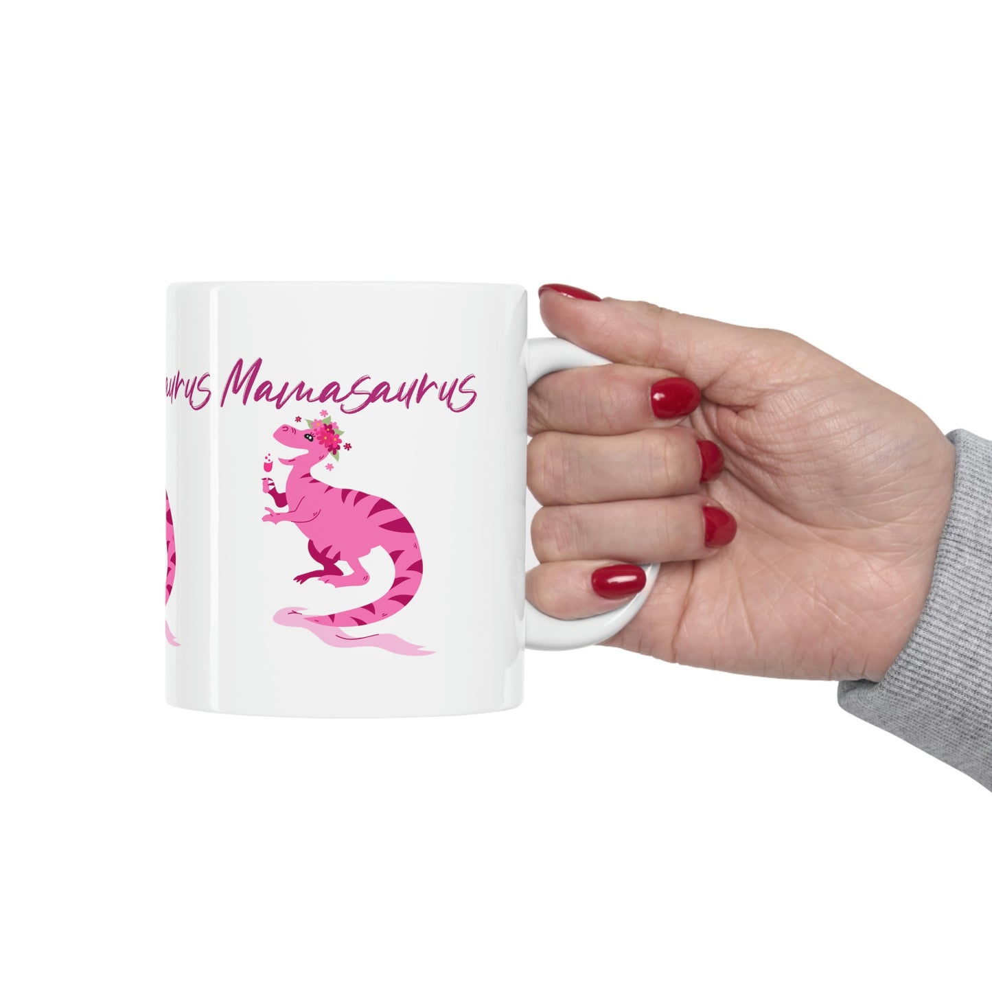Mock up of our mug being held by someone with red fingernail polish