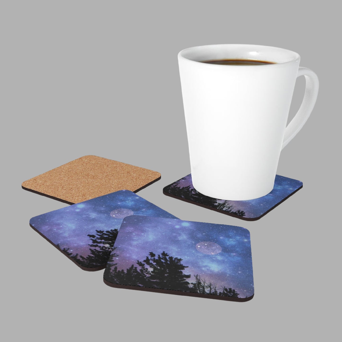 Mock up of our Blue Full-Moon Coasters featuring a latte mug and 3 front side and 1 cork-back view