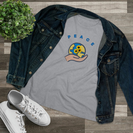 Mock up of our t-shirt under a denim jacket next to a pair of white sneakers