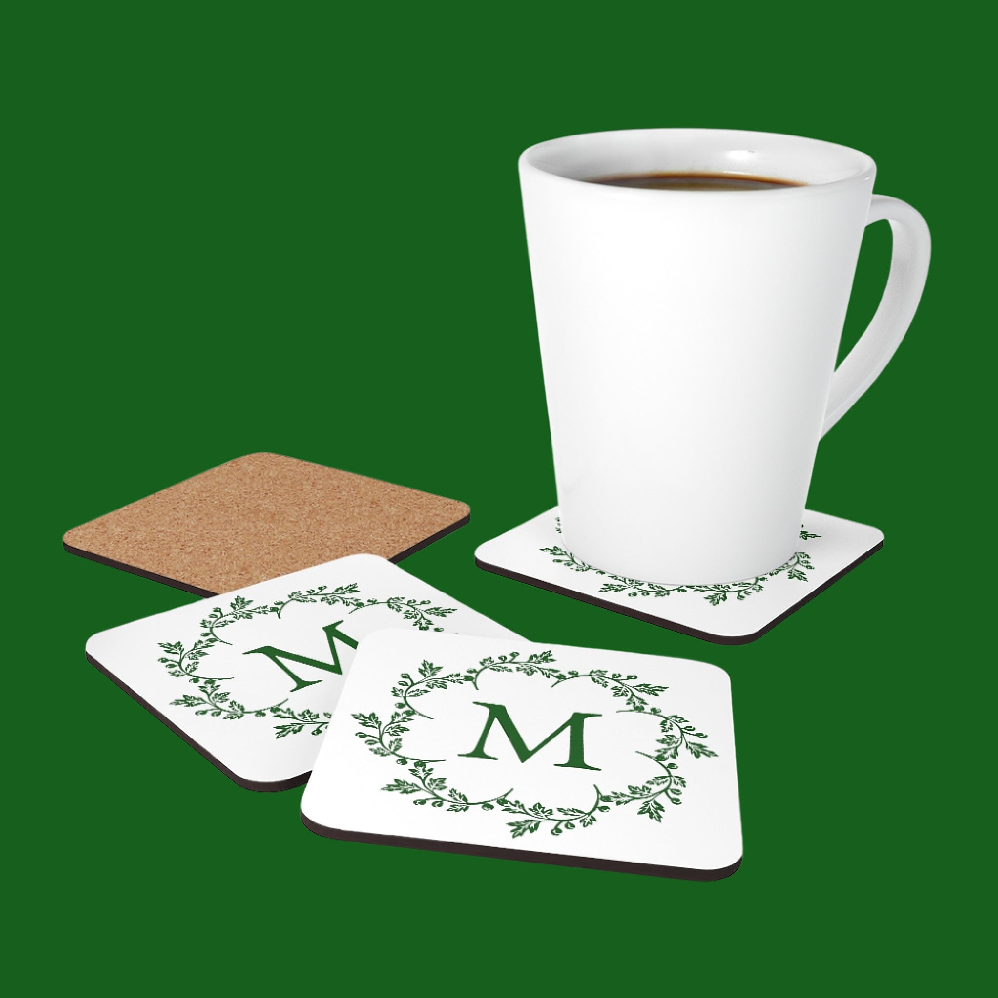 Mock up of a white latte mug on one of our Customized Monogrammed Coasters surrounded by 3 others