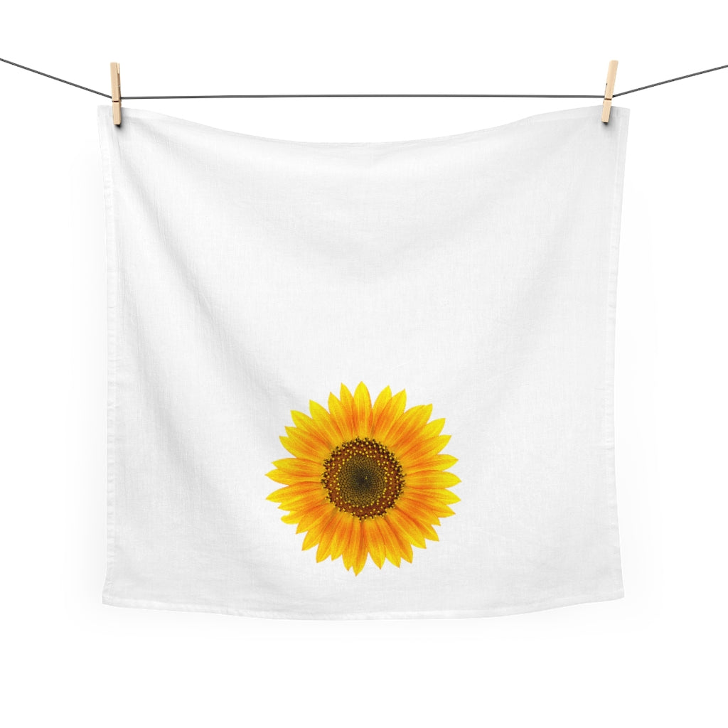 Front view of our Sunflower Kitchen Towel hanging from 2 clothes pins