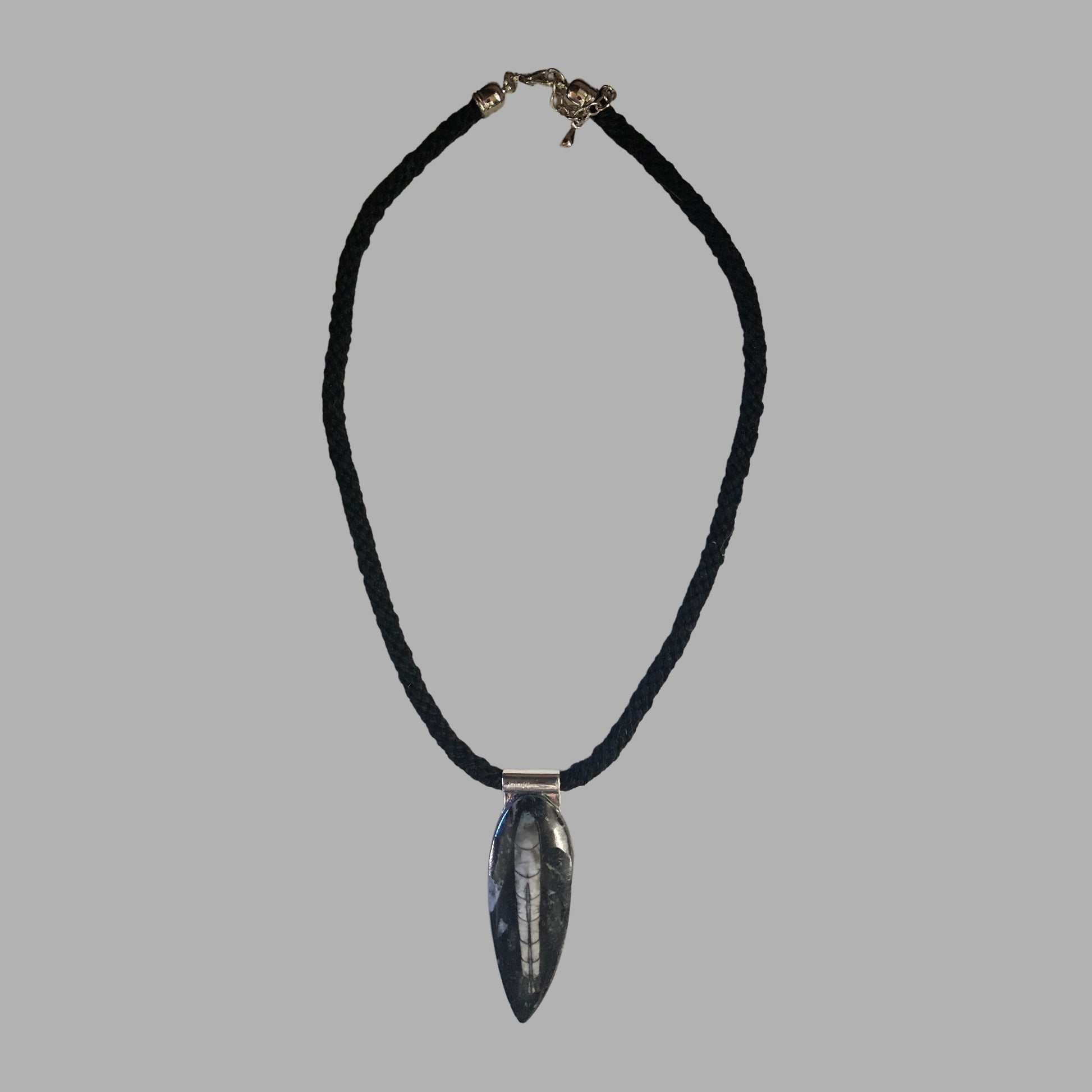 Flat overview of the kumihimo braided necklace with the Orthoceras stone