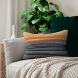 Mock up of our Orange-Sunset Lumbar Pillow displayed on a beige sofa.