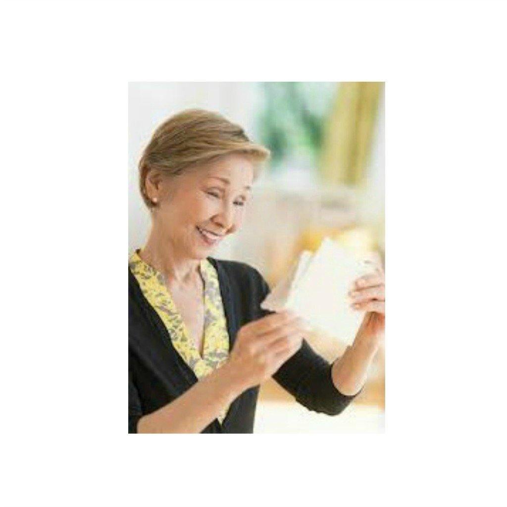 Smiling woman reading a card