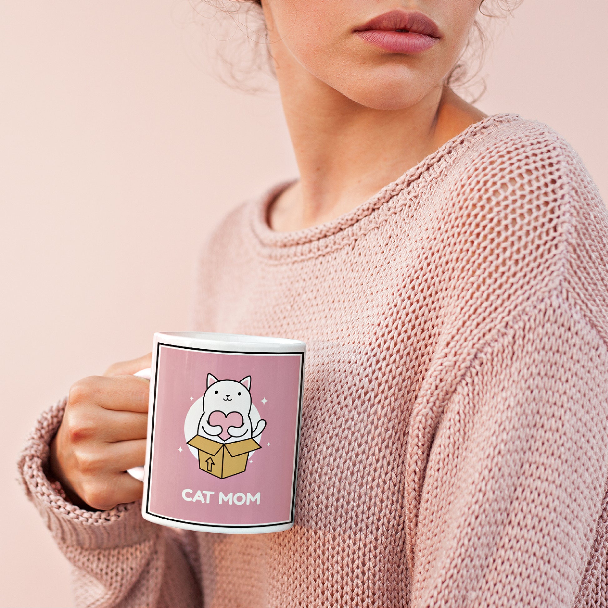 Mock up of a woman holding our Cat-Mom Ceramic Mug