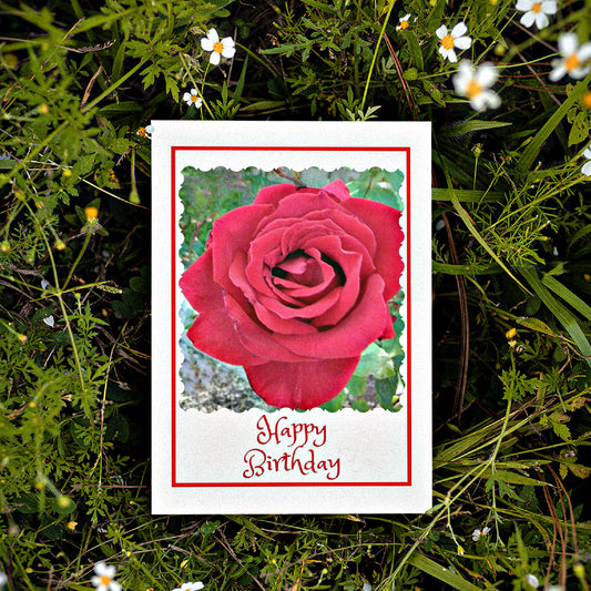 Mock up of our Birthday Greeting Card lying on a bed of small white flowers