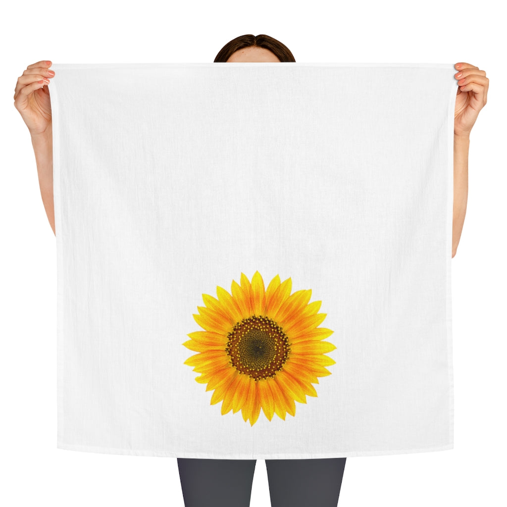 Our large Sunflower Kitchen Towel being held by 2 hands