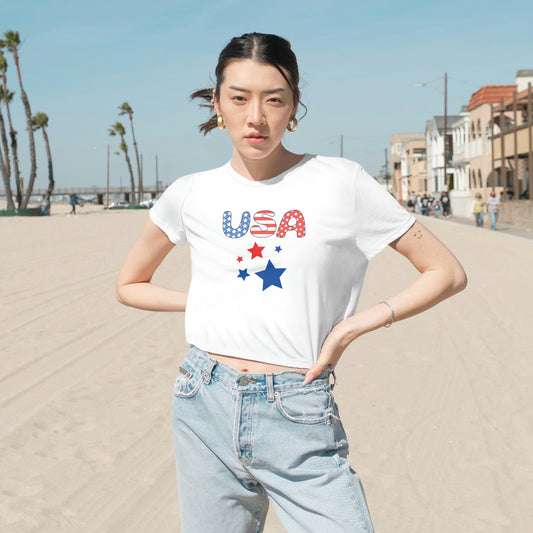 Mock up of a woman on the beach wearing the White shirt