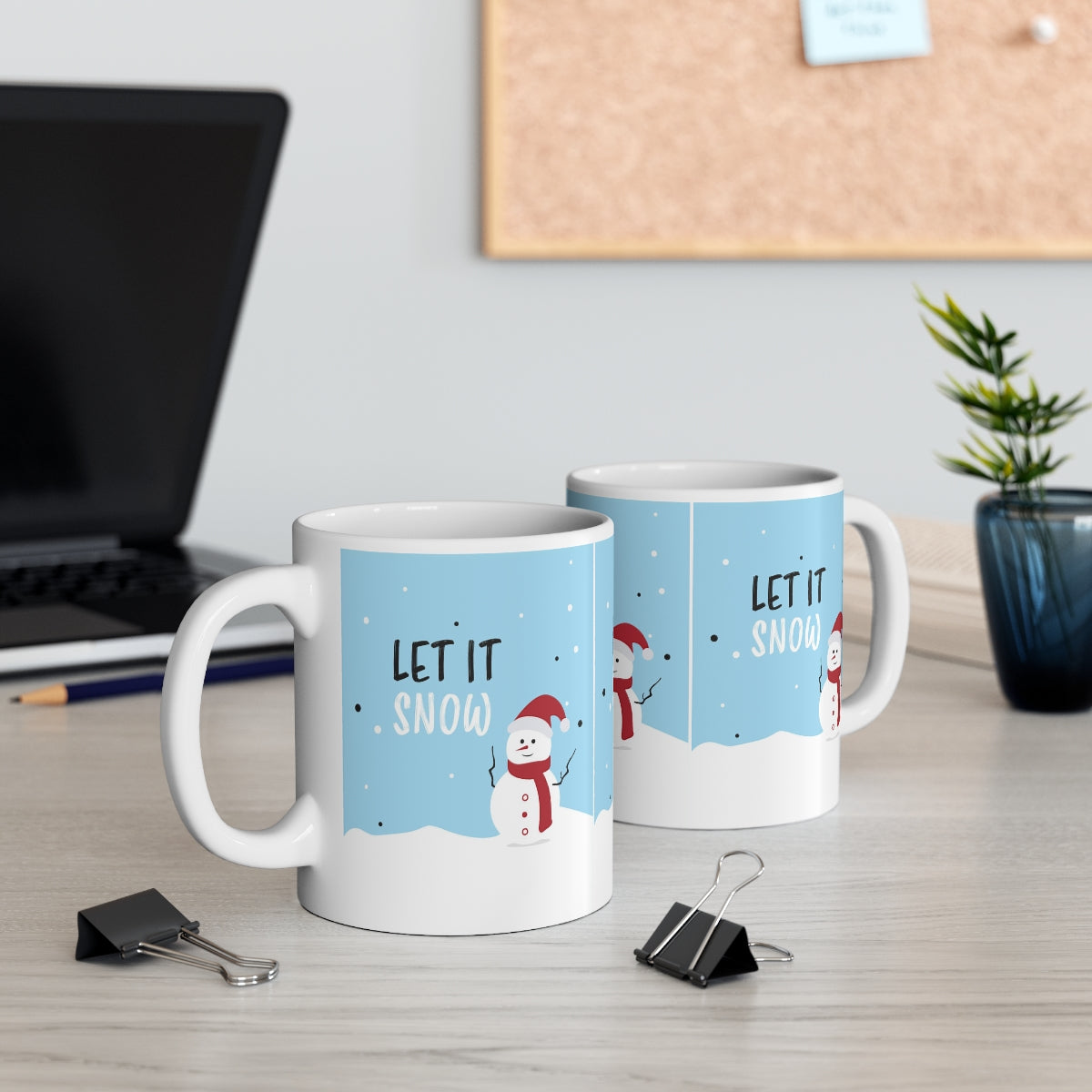 Mock up of two mugs on a surface near a computer