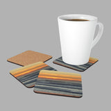 Mock up of a coffee mug on one of the Sunset-Seascape Coasters with the other 3 nearby