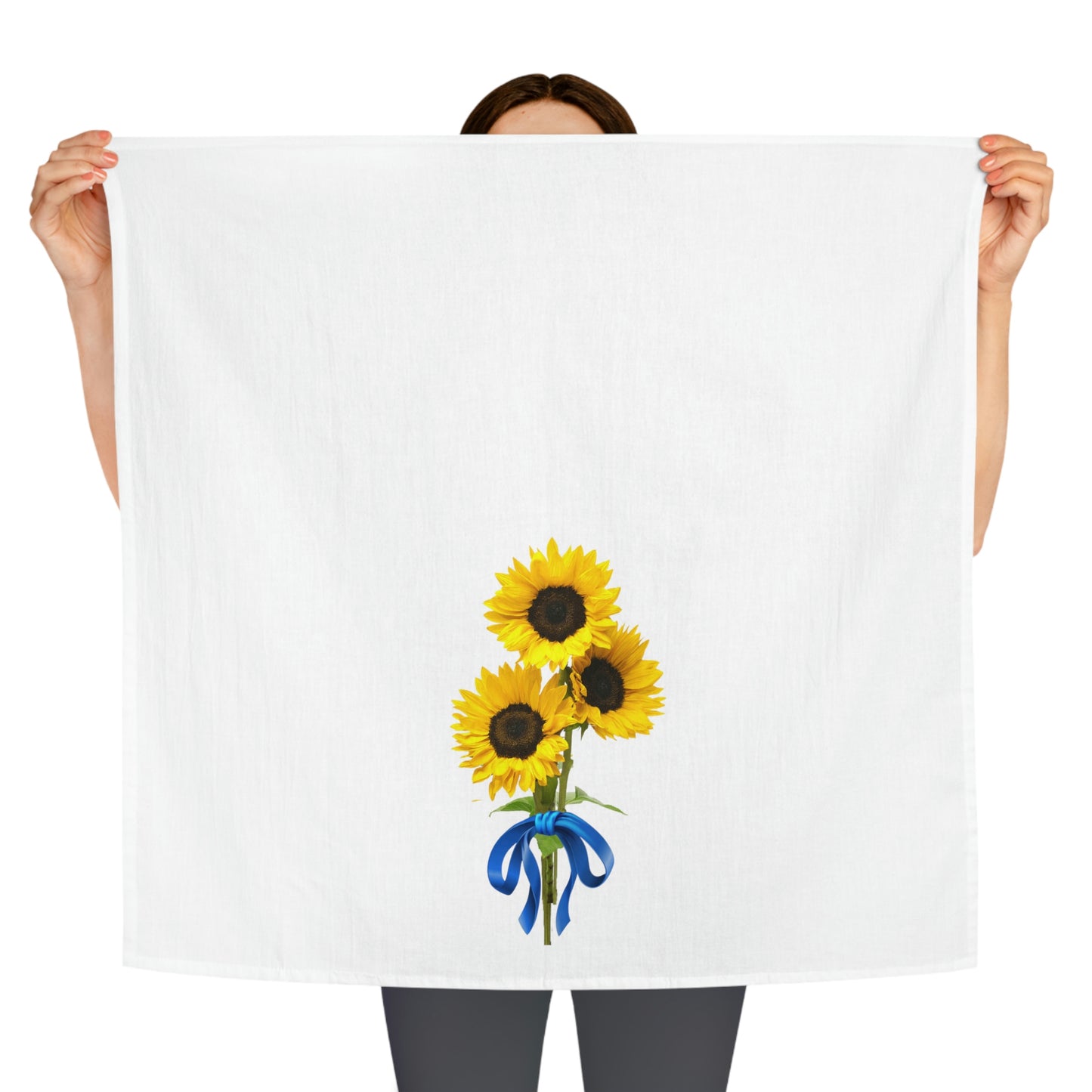 Towel being held by someone showing placement of the design