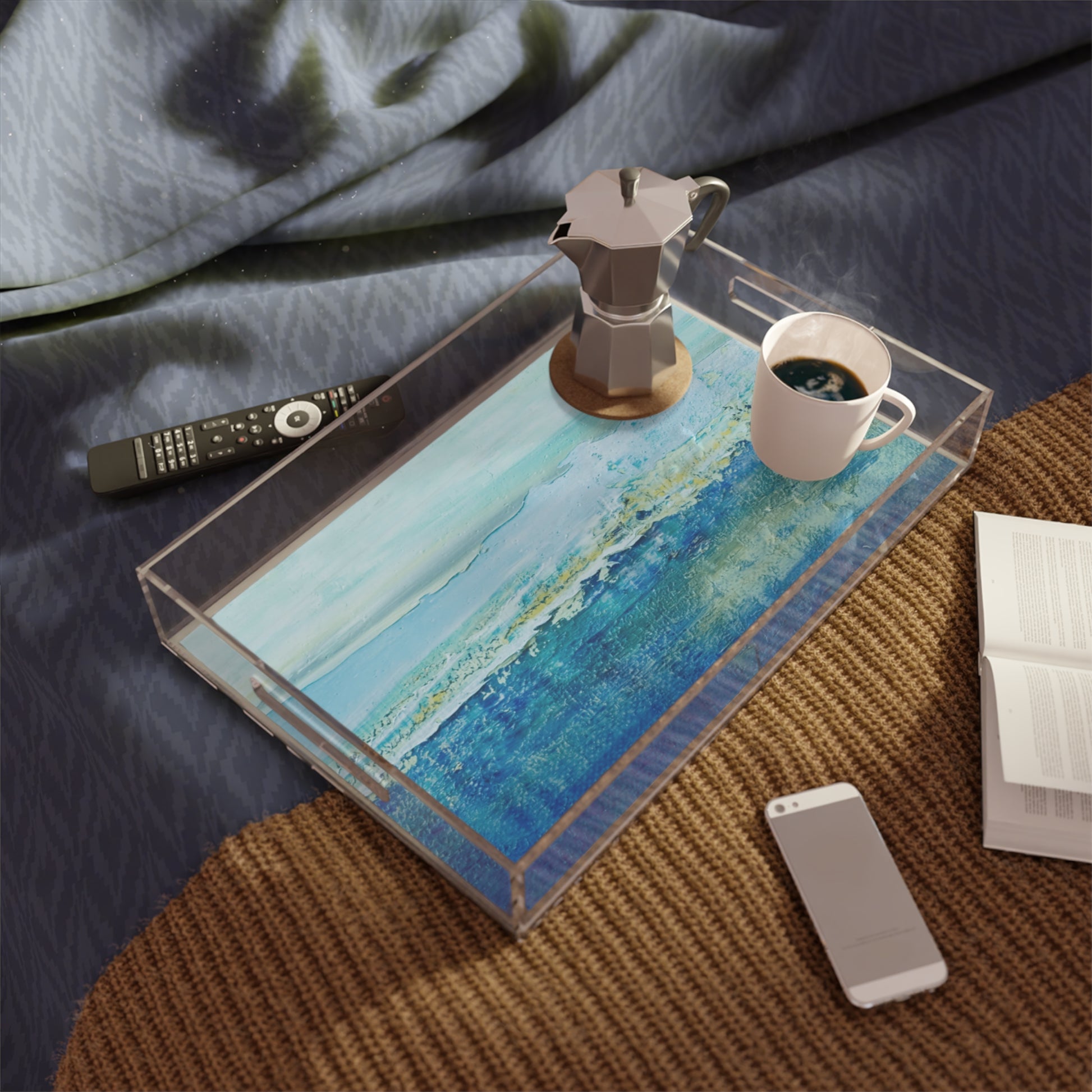 Mock up of the tray on a bed with coffee cup surrounded by electronic devices