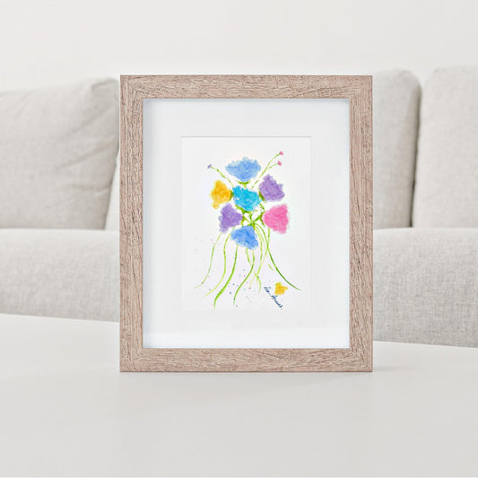 Mock up of our Floral Watercolor Print standing on a table 