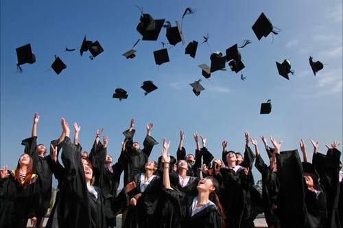 Graduation  caps being tossed into the air in celebration