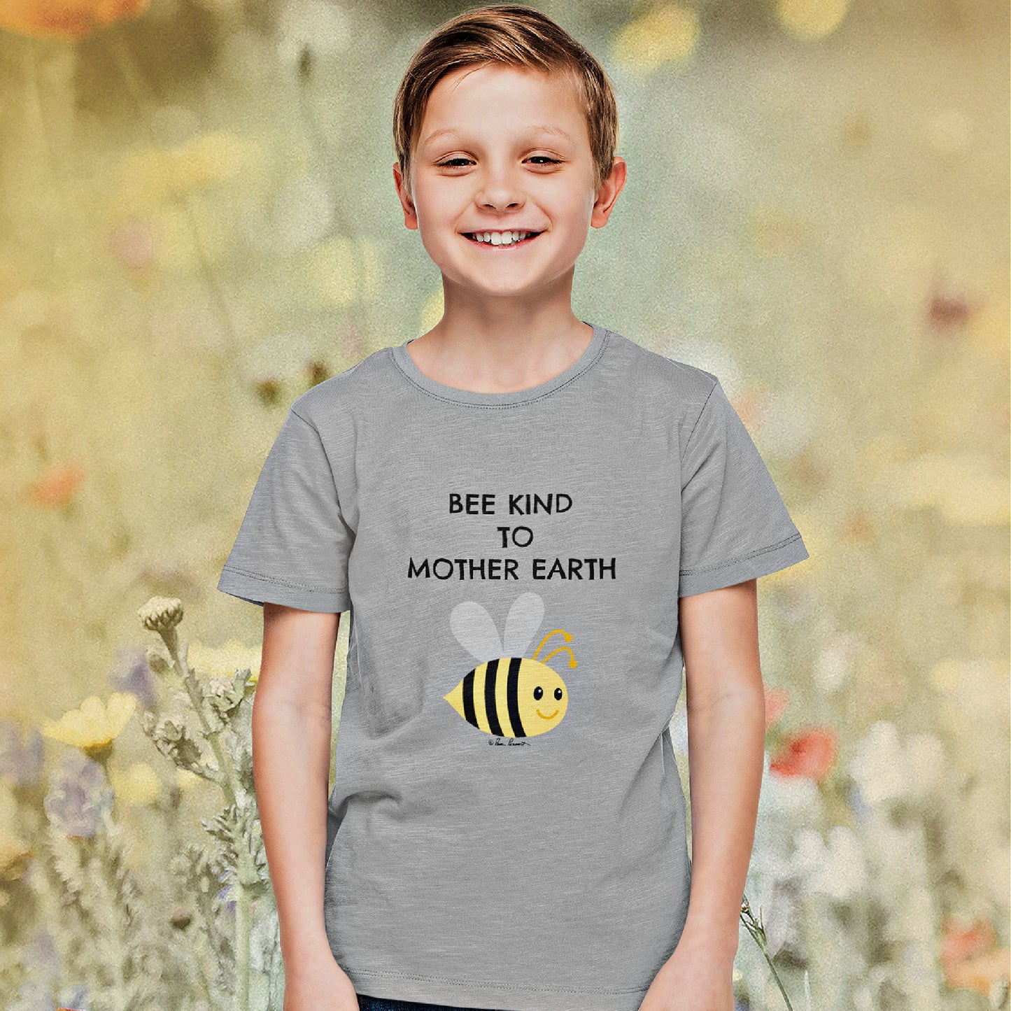 Mock up of a smiling boy wearing our t-shirt