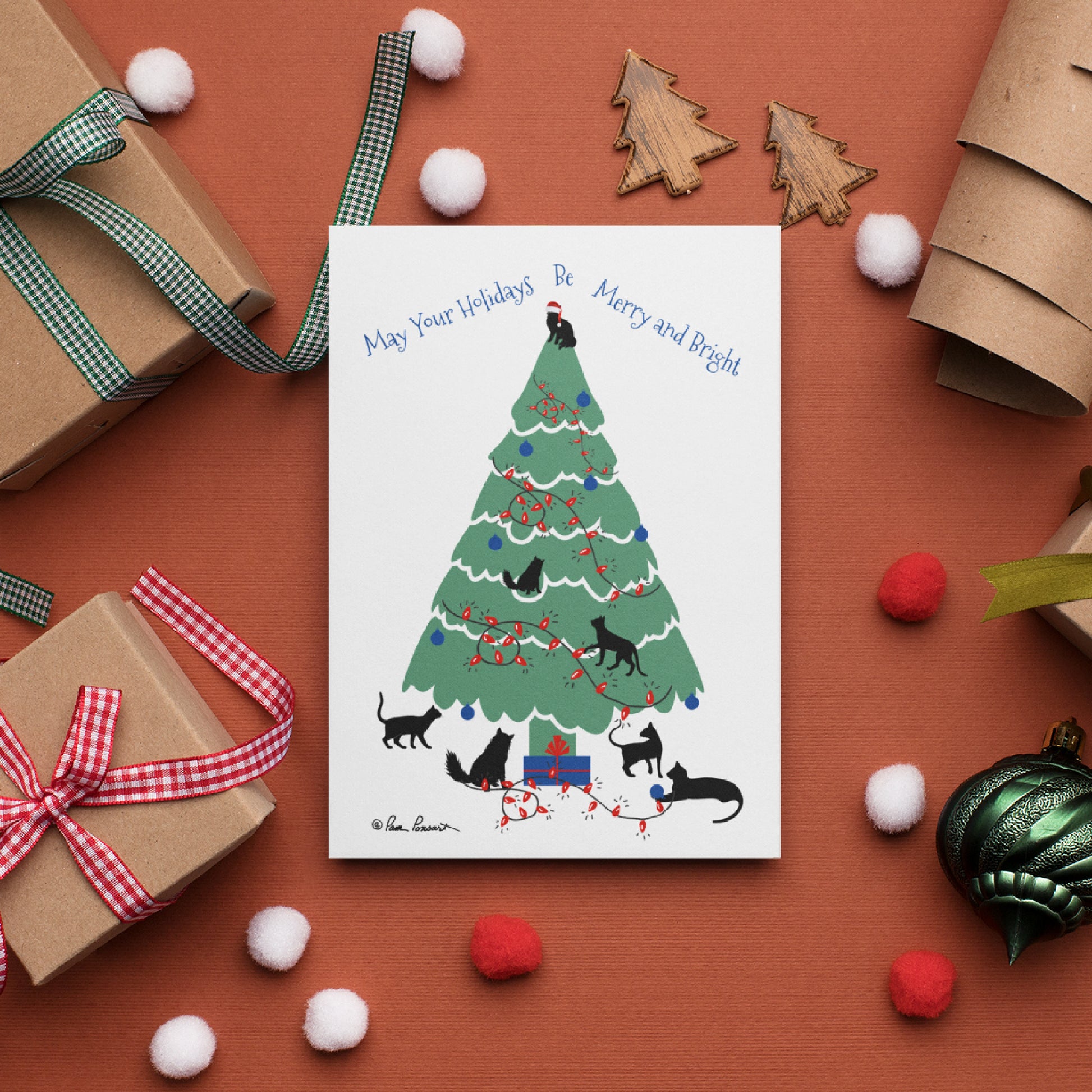 Mock up of our Cat-Art Holiday Card featuring funny frolicking felines