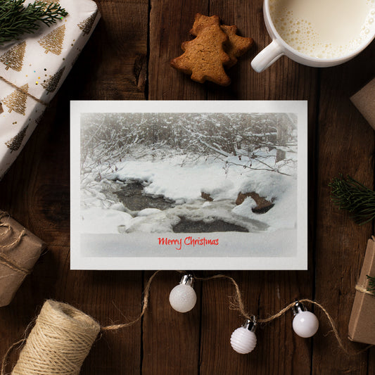 Mock up of our White Christmas Card on a table