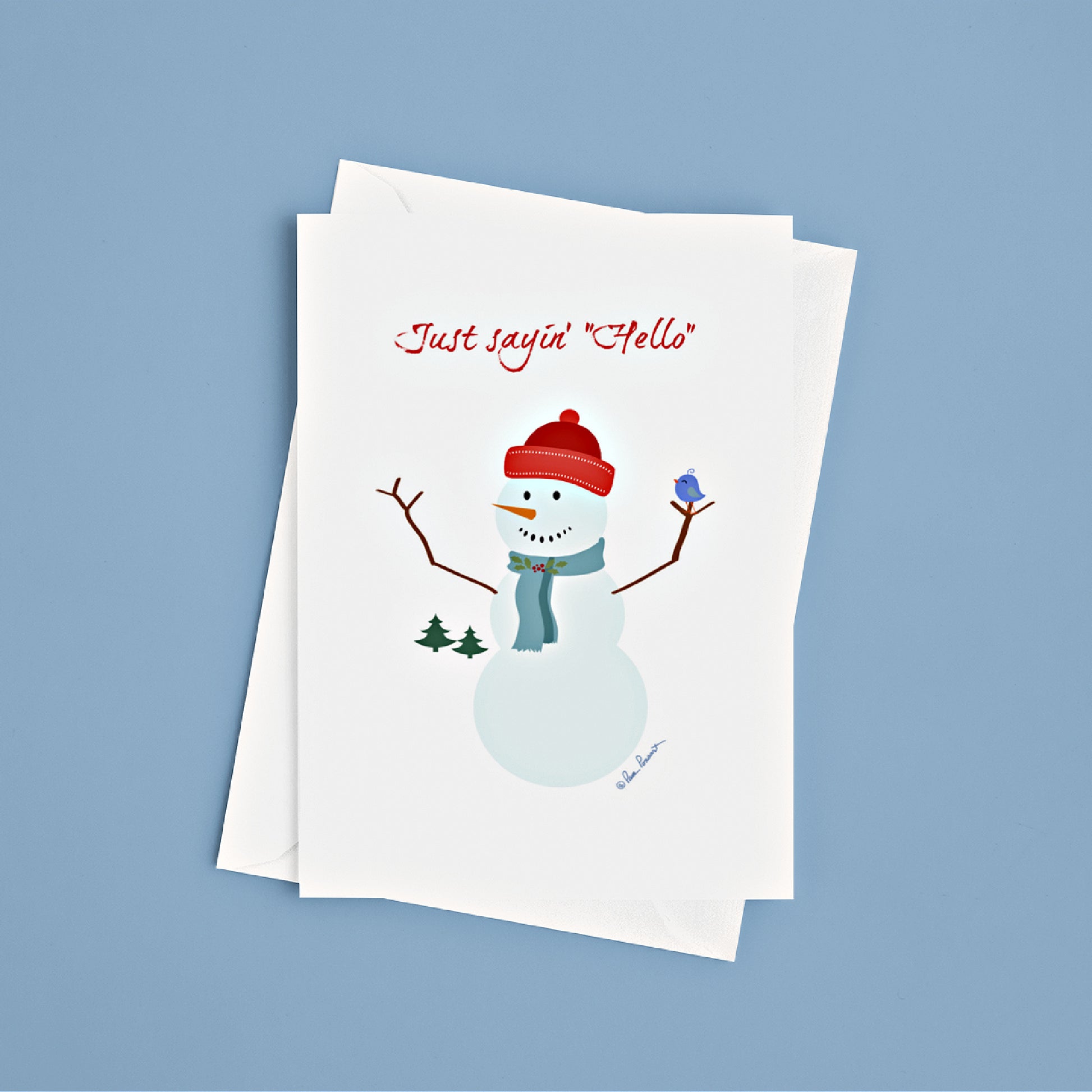 Front view of our Joyful Snowman Card on a blue surface