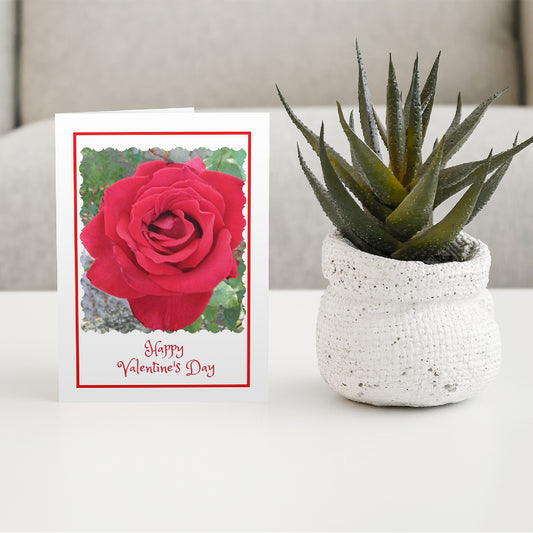 Mock up of our Vintage-Inspired Valentine visible on a table next to a small potted cactus