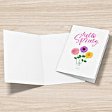 Mock up of our Hello-Spring Greeting Card; one lying open and another showing the front of the card