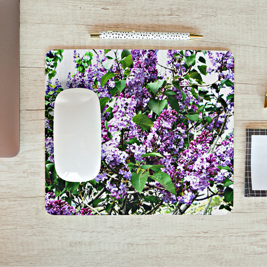 Mock up of our Purple-Lilacs Mouse Pad on a wooden surface with other office accessories
