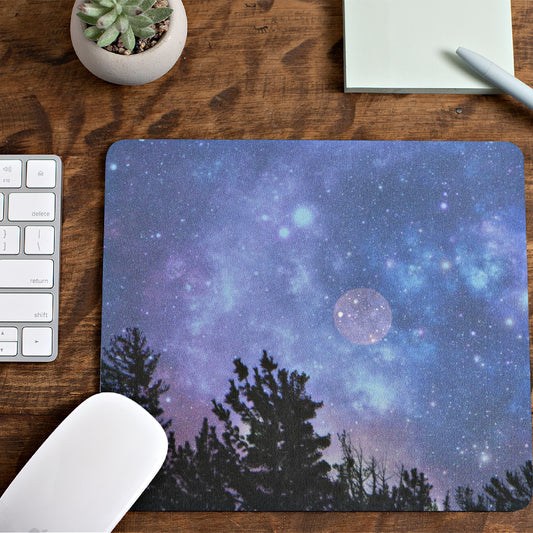 Mock up of our Blue-Moon Mouse Pad on a surface next to some office supplies