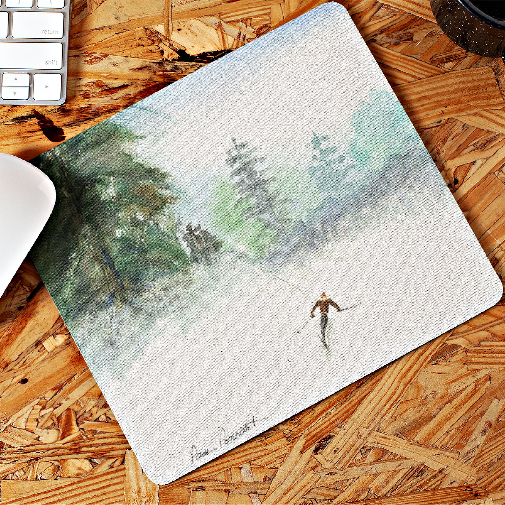 Mock up of our mouse pad lying on a wooden surface