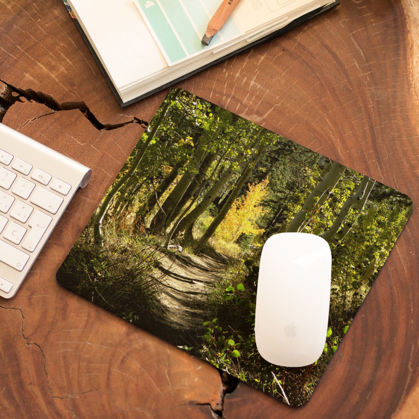 Mock up of our Inspirational Mouse Pad on a wooden workstation