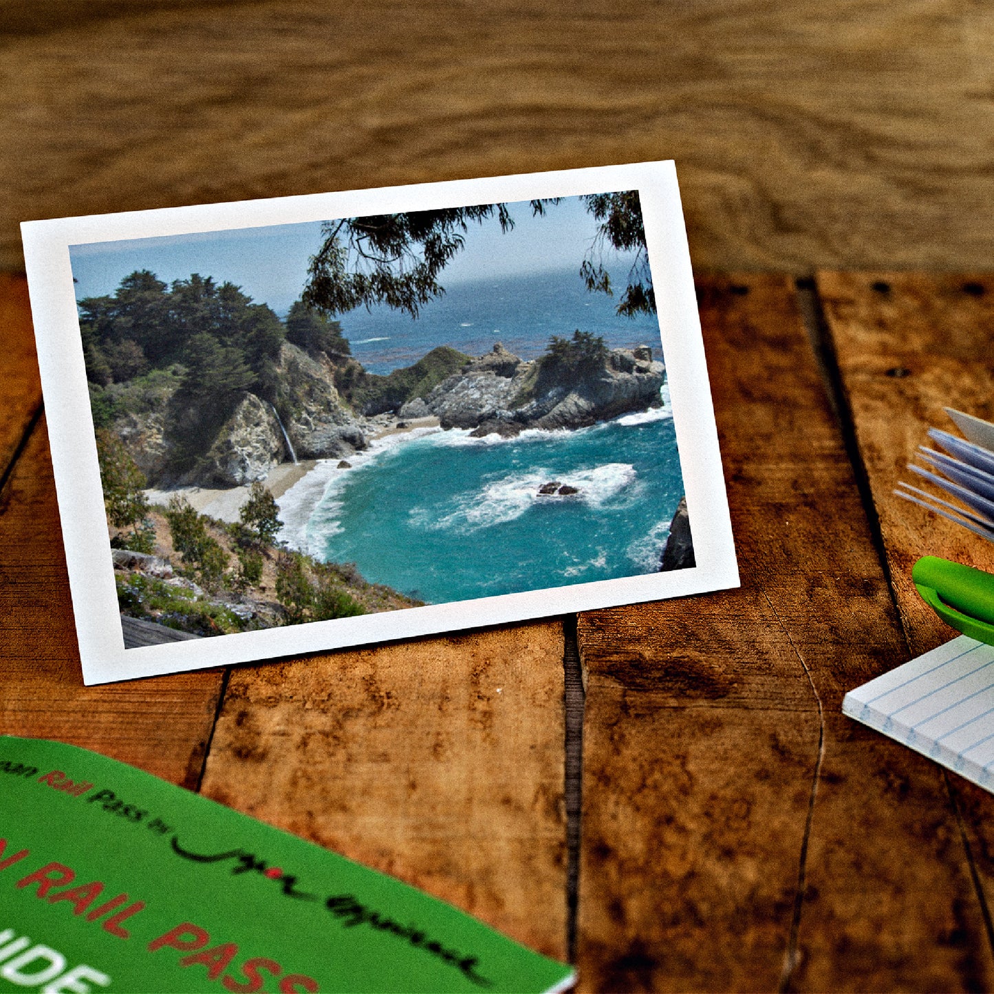 Mock up of our Big-Sur Photo Card on a wooden table