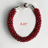 Red Beaded Bracelet measuring 8.25" around