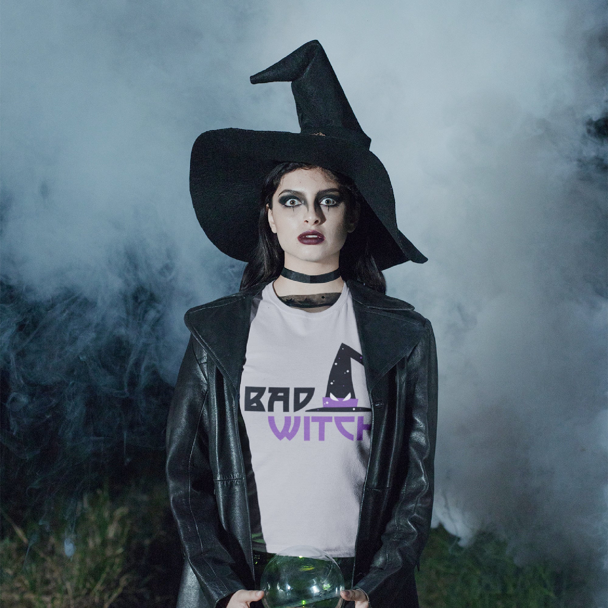 Mock up of a Woman wearing a spooky witch costume and our Women's Slim-Fit T-shirt with the Bad Witch design