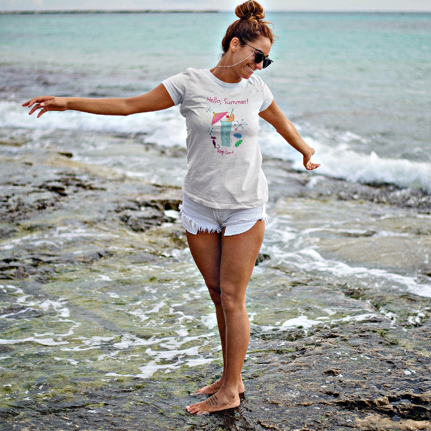 Mock up of a happy girl at the beach wearing our t-shirt