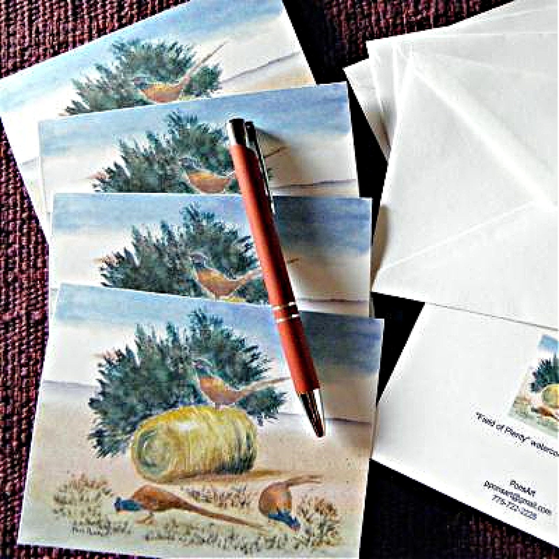Photo of a 4-piece set of Pheasant Note Cards with a ball-point pen on top.