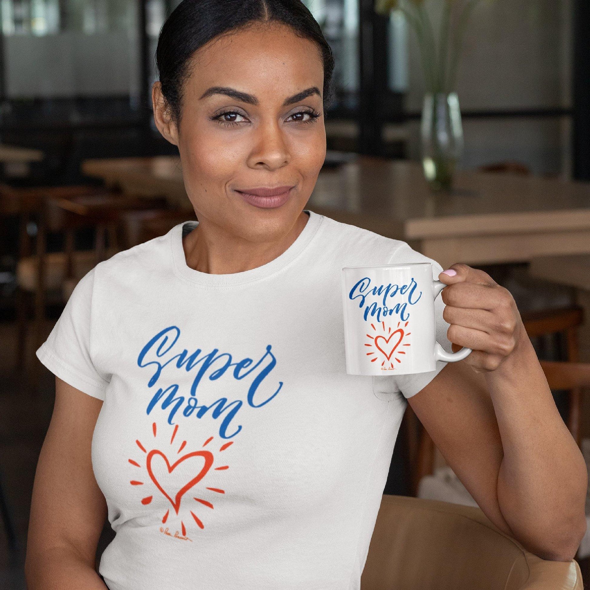 Mock up of a woman wearing our T-shirt while also holding the coordinating mug 