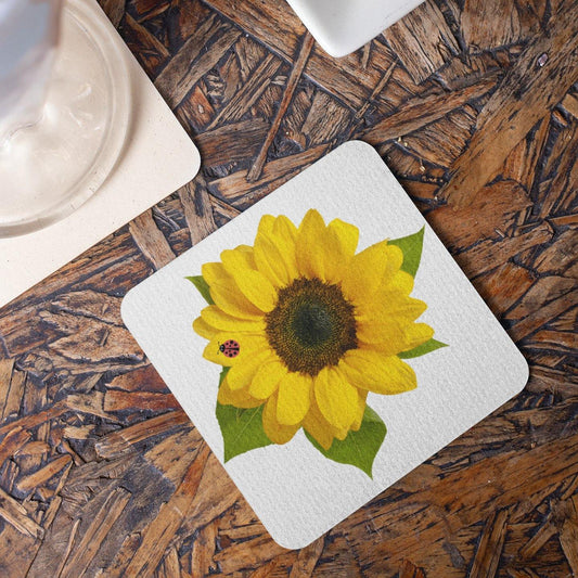 Mock up of one of our Sunny Sunflower Coasters on a  table